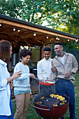 Gay couples enjoying barbecue