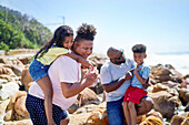 Family on seaside rocks