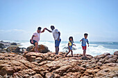 Family on seaside rocks