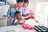 Family baking cupcakes