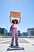 Young female protester with sign