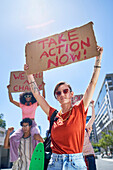 Young protesters holding change signs