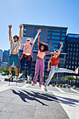 Young friends jumping for joy