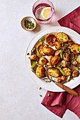 Lemon and rosemary roast potatoes with sausage