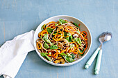 Carrot pasta with spinach and nut pesto