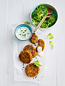 Vegetable fritters with sour cream and leaf salad
