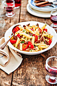 Penne with steak strips, almonds and tomatoes