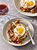 Fried egg with red wine sauce, mushrooms and bacon