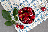 Red cherry in a small bowl