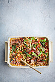Mongolian beef and rice casserole with sesame seeds