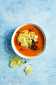 Pumpkin soup with cheddar and crisps