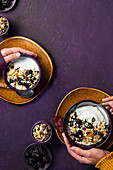 Yoghurt with oat flakes, plums and dried fruit