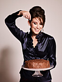Model with chocolate cake