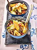Chinese noodles with shiitake, cabbage and omelette