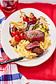 Steak with tagliatelle, gorgonzola sauce and roasted vegetables