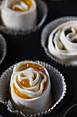 Puff pastry buns with jam before baking