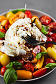 Caprese salad with colourful tomatoes