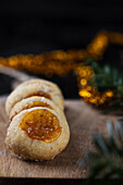 Thumbprint cookies on a wooden board