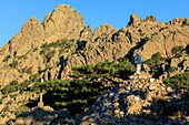 France,Corse du Sud,Quenza,Col de Bavella,Our Lady of the Snow,white virgin of Alta Rocca,Needles of Bavella in the background