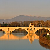 France,Vaucluse,Avignon,Saint Benezet bridge on the Rhone dating from the 12th century listed UNESCO World Heritage,the Mont Ventoux in the background