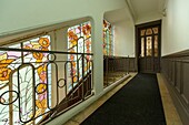 France,Meurthe et Moselle,Nancy,staircase and Art Nouveau stained glass window by Jacques gruber in the staircase of former Arnoux Masson shop (1911) by architect Louis Deon in Saint Dizier street