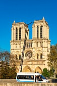 France,Paris,area listed as World heritage by UNESCO,Ile de la Cite,the towers of Notre Dame cathedral,crane for protection