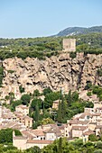 France,Var,Provence Verte,Cotignac,the village at the foot of a tuff cliff 80 meters high and 400 meters wide and one of the two towers remains of the feudal castle