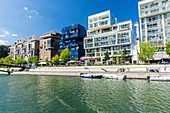 France,Rhone,Lyon,the district La Confluence south of the Presqu'ile,close to the confluence of the Rhone and the Saone rivers,it's the first French sustainable quarter certified by WWF,residential buildings on the quai Antoine Riboud on the edge of the nautical basin connected to the Saone river and the footbridge of place nautique