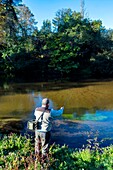 France,Gironde,Val de L'Eyre,Parc Naturel Régional des Landes de Gascogne,fly fishing on the river Leyre