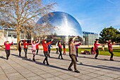 France,Paris,Parc de la Villette,Chinese gymnastics lesson in front of the Geode