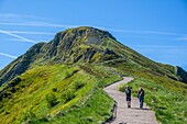 France,Cantal,Regional Natural Park of the Auvergne Volcanoes,monts du Cantal,Cantal mounts,hikers in the ascent of puy Mary