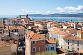 France,Var,Saint-Raphaël,the old center and Notre-Dame de la Victoire basilica,the Maures massif in the background