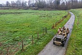 France,Eure,Sainte Colombe prés Vernon,Allied Reconstitution Group (US World War 2 and french Maquis historical reconstruction Association),reenactors in uniform of the 101st US Airborne Division progressing in a jeep Willys (aerial view)