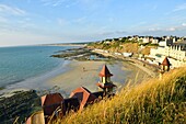 France,Manche,Cotentin,Granville,the Upper Town built on a rocky headland on the far eastern point of the Mont Saint Michel Bay,Plat Gousset beach and promenade,the casino towers in the foreground