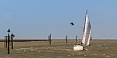 France,Somme,Baie de Somme,Saint Valery sur Somme,Return to the port of a sailboat in the channel of the Somme at Cape Hornu