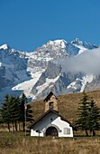 France,Hautes Alpes,la Grave,Oisans massif,the chapel of the Lautaret pass and the Meije mountain