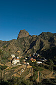Spain,Canary Islands,Island of La Gomera,View of Town with Roque Cano in background,Vallehermoso