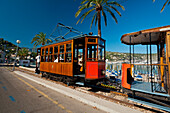 Spain,Port Soller,Majorca,Port Soller to Soller tram going past beach