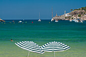 Spain,Pair of beach umbrellas on beach of Port Soller,Majorca