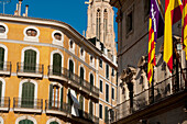 Spain,Majorca,spire of Santa Eulalia church and residential building in Placa de Cort,Palma,17th Century Town Hall