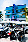 USA.,Florida,Miami,Ocean Drive,South Beach,Group of motorbikes parked out the Colony Hotel