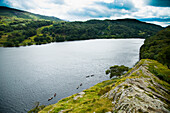 UK,North Wales,Snowdonia National Park,Nantgwynant,glistening in the sunlight. view over the lake from a rocky outcrop,Llyn Gwynant Campsite,Lake Nant Gwynant