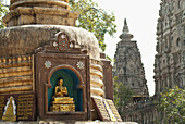 India,Bihar,Stupa with small Buddha beside Mahabodhi Temple,Bodhgaya