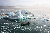 Greenland,Icefjord,Ilulissat,Fishermen going out to sea at Unesco World Heritage Site