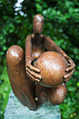 UK,Ireland,County Kerry,Mill Cove Gallery,Sculpture covered in water droplets in sculpture garden
