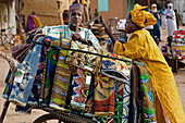 Niger,Tuareg Men Shopping For Garments At Housa Trader's Stall. Agadez's Livestock Market,Agadez