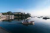 Men Standing In A Motorboat Ready For Fishing,Skye,Scotland