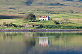 A Lone House Along The Shoreline Of The Water,Skye,Scotland