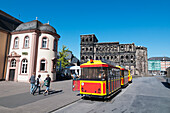 Students Walk Down The Road Beside The Streetcars,Trier,Germany