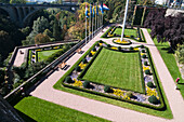 Paths Around A Landscaped Area With Flags And A Bridge Over A Gorge In The Distance,Luxembourg